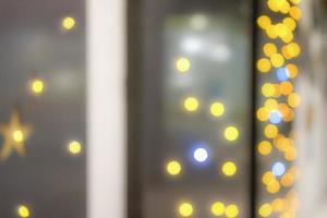 Blur abstract onion ring yellow and orange bokeh and Star shape bokeh withe plain grey background. photo