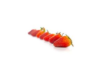 Fresh luxury Strawberry are arranged in the row and column with studio light on the white background. photo