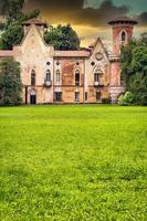 Miradolo castle, gothic design full of mystery, with sunset light. photo