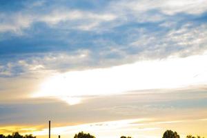 Blurred background. Blue sky and white fluffy clouds. photo