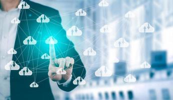 Man touching connect to data information on the Cloud Computing Technology Internet Storage Network Concept And a large database big data Through internet technology, Cloud sharing download and upload photo