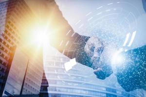 Business people shaking hands finishing meeting in office,Close up of handshake with digital pattern and map.Online business concept, marketing project,successful contract agreement to become teamwork photo