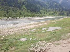 Kashmir is the most beautiful region in the world which is famous for its green valleys, beautiful trees, high mountains and flowing springs. photo