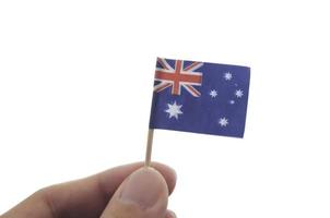 mini bandera nacional australiana sosteniendo con los dedos foto