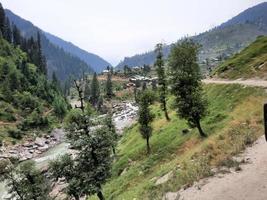 Kashmir is the most beautiful region in the world which is famous for its green valleys, beautiful trees, high mountains and flowing springs. photo