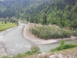 Kashmir is the most beautiful region in the world which is famous for its green valleys, beautiful trees, high mountains and flowing springs. photo