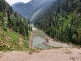 Kashmir is the most beautiful region in the world which is famous for its green valleys, beautiful trees, high mountains and flowing springs. photo