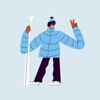 Happy skier with skis. A man in ski goggles and warm clothes is holding skis. Smiling guy in a ski suit posing for a photo on a blue background. vector