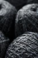 Tangles of gray yarn made of natural wool close-up photo