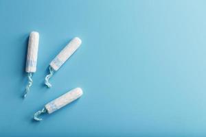 Gynecological tampons on a blue background top view photo