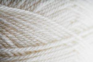 White threads of natural wool close-up in full screen photo