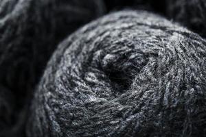 Tangles of gray yarn made of natural wool close-up photo