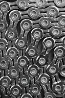 The texture of a bicycle chain is a close-up of the torque transmission links photo