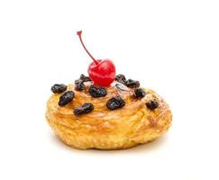 danish pastry with raisin and red cherry  isolated on white background photo