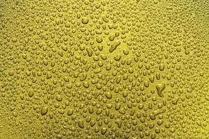 Shiny golden metal wall with droplet texture background,gold pattern photo