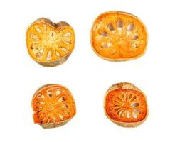 Dry bael fruit or Aegle marmelos isolated on white background photo