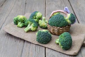 broccoli in basket  wood background photo