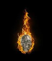 Fire skull on black background photo