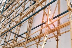 scaffolding at construction with wooden bamboo photo