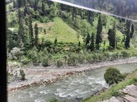 Kashmir is the most beautiful region in the world which is famous for its green valleys, beautiful trees, high mountains and flowing springs. photo