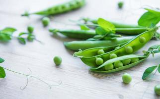 Green peas with leaves photo