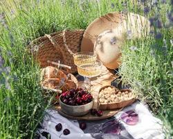 Summer picnic on a lavender field photo