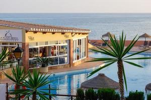 CALAHONDA, ANDALUCIA, SPAIN - MAY 8. Evening sunshine at Dona Lola holiday resort in Calahonda Spain on May 8, 2014. Unidentified people. photo