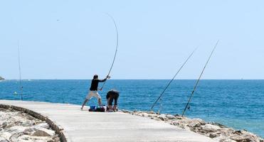 CABO PINO, ANDALUCIA, SPAIN - MAY 6. Fishing at Cabo Pino. Malaga Province Andalucia Spain on May 6, 2014. Unidentified people. photo