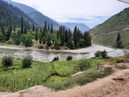 Kashmir is the most beautiful region in the world which is famous for its green valleys, beautiful trees, high mountains and flowing springs. photo