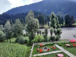 Kashmir, Pakistan, Aug 2022 - Kashmir is the most beautiful region in the world which is famous for its green valleys, beautiful trees, high mountains and flowing springs. photo