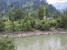 Kashmir is the most beautiful region in the world which is famous for its green valleys, beautiful trees, high mountains and flowing springs. photo