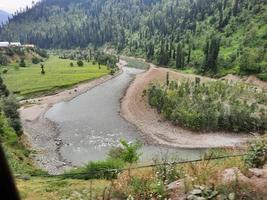 Kashmir is the most beautiful region in the world which is famous for its green valleys, beautiful trees, high mountains and flowing springs. photo