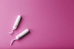 Gynecological tampons on a pink background free space photo