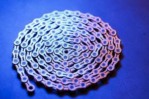 Patterns of a technological bicycle chain braided in a circle photo