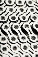 The texture of a bicycle chain is a close-up of the torque transmission links photo