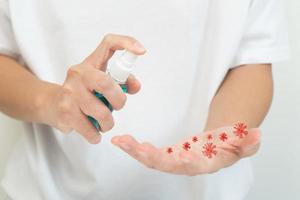 woman clean hand with alcohol gel for protect Virus photo