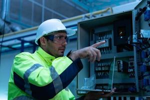 Chief Engineer of Mechanical Plant Checking the electronic circuit of the machine to check readiness photo