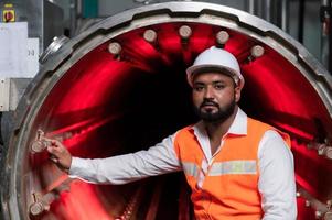 Chief Engineer of the Mechanical Plant Conduct inspection of the sterilization machine tunnel. To check the working condition of the machine to be ready photo