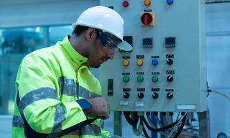 Chief Engineer of Mechanical Plant Checking the electronic circuit of the machine to check readiness photo