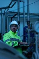 Engineer of the Mechanical Plant Conduct inspection of the sterilization machine tunnel. To check the working condition of the machine to be ready photo