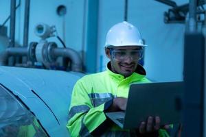 Engineer of the Mechanical Plant Conduct inspection of the sterilization machine tunnel. To check the working condition of the machine to be ready photo