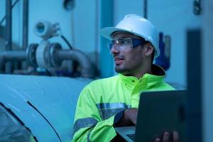 Engineer of the Mechanical Plant Conduct inspection of the sterilization machine tunnel. To check the working condition of the machine to be ready photo