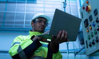 Chief Engineer of Mechanical Plant Checking the electronic circuit of the machine to check readiness photo
