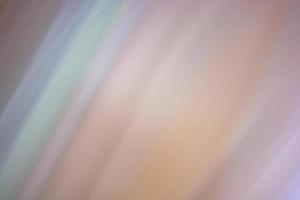 Abstract multicolored background with softly blurred diagonal lines in beige shades photo