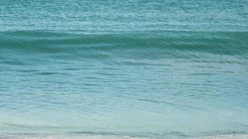 Waves rolled on the sand of Mai Khao Beach, Phuket, Thailand. Slow motion video