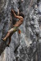 rock climber climbs the rock. photo