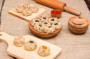 Dim sum or dimsum flatlay photo with wooden plate