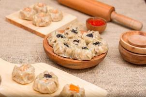 Dim sum or dimsum flatlay photo with wooden plate