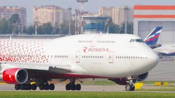 MOSCOW, RUSSIAN FEDERATION SEPTEMBER 12, 2020 - Rossiya Boeing 747 EI XLF lining up on the runway before departure behind Pilatus PC 12 turboprop aircraft running for take off video