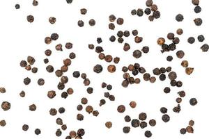 Black pepper pile or Black peppercorns seeds isolated on white background. photo